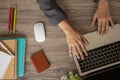 Top view of business woman desk with her hands which are typing on laptop Royalty Free Stock Photo