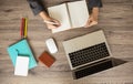 Top view of business woman desk with her hands which are typing on laptop Royalty Free Stock Photo