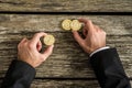 Top view of a businessman counting golden Bitcoins Royalty Free Stock Photo