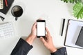 Top view businessman hands using mockup smart phone on office desk Royalty Free Stock Photo