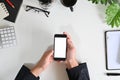 Top view businessman hands using mockup smart phone on office desk Royalty Free Stock Photo