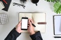 Top view businessman hands using mockup smart phone on office desk Royalty Free Stock Photo