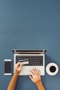 Top view of businessman office desk with credit card for online payment on laptop computer  flat lay on color background Royalty Free Stock Photo