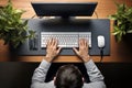 Top view of businessman working on computer at desk in office. Business concept, High angle view of male hands typing on computer Royalty Free Stock Photo