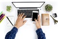 Top view businessman working with modern devices and smartphone, Man hand on laptop keyboard with blank screen monitor Man hand on