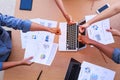 Top view of businessmen and businesswoman thumbs up over table in a meeting with copy space at mobile office. Teamwork, diversity Royalty Free Stock Photo