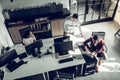 Top view of businessmen working in the team in spacious office