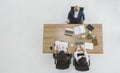 Top view of businesswoman discussing working at table in office.