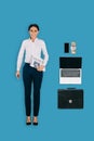 top view of businesswoman with newspaper, briefcase, laptop, smartphone and money Royalty Free Stock Photo