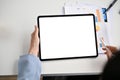 Top view of a businesswoman using her digital tablet at her desk Royalty Free Stock Photo