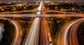 Top view of busy highway interchange illuminated at night symbolizing fast logistics flow Royalty Free Stock Photo