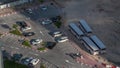 Top view busy parking lot with many cars moving in and out timelapse.