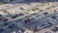 Top view busy parking lot with many cars moving in and out timelapse. Royalty Free Stock Photo