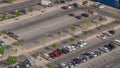 Top view busy parking lot with many cars moving in and out timelapse.