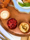 Top view of butter and jam on a bronze tray