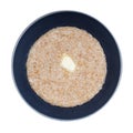 Top view of buttered porridge from wheat groats