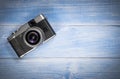 Top view camera on blue wooden table Royalty Free Stock Photo