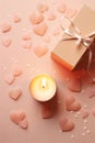 Top view candle, red roses and Valentine's day gift box on peach fizz background, copy space.