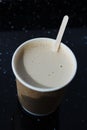 Top view cappuccino paper cup with a stick