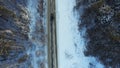 Top view of the car riding in the woods. Footage. The car goes on a winter road in the woods Royalty Free Stock Photo