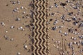 Car tire tracks leading through sand beach background Royalty Free Stock Photo