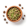 Top view of Cardamom spice in an earthen pot isolated on white background