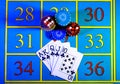 Top view of cards in a royal flush layout, a straight flush from ten to ace next to game chips and dice for playing Royalty Free Stock Photo