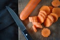 Top view of Carrot Cutting on Wooden Board