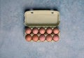 Top view of carton with dozen fresh eggs