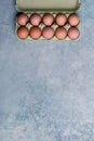 Top view of carton with dozen fresh eggs