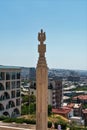 Armenia, Yerevan, September 2021. A stone stele as a modern khachkar and a view of the city.