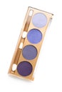 Top view of case with different shaded purple cosmetic eye shadows Royalty Free Stock Photo