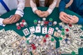 Top view of casino playing desk with players hands Royalty Free Stock Photo