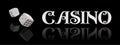 Top view of Casino sign and poker dice on black background. Online casino wide banner with casino game and place for
