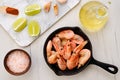Top view of cast iron skillet with steamed unpeeled shrimps