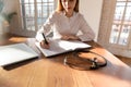 Caucasian female doctor make notes in medical journal Royalty Free Stock Photo