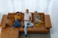 Top view of Caucasian happy family sitting and watching television in living room at home and spent quality time together for Royalty Free Stock Photo