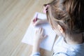 Little girl writing with fountain pen in her notebook Royalty Free Stock Photo