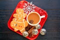 Top view center gingerbread men top view mug of coffee on red dish Royalty Free Stock Photo