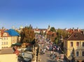 Top view of center of Prague with its red roofs and tourists on the Charles bridge, Prague,