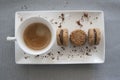 Top view of ceramic cup with espresso coffee on rectangular whit