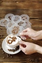 Top view of ceramic cup of hot cappuccino coffee latte with drawing picture of cafe sign with cinnamon or cocoa on milk Royalty Free Stock Photo