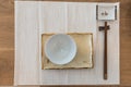 Top view ceramic dish plate and chopsticks on wooden table