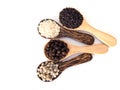 Top view of cereal herbs in wooden spoon with white pepper, black pepper, black sesame and white sesame . Royalty Free Stock Photo