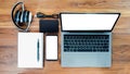 Top view with charger, camera, USB, headset, notebook, pen, mockup smartphone, white screen display laptop personal laptop