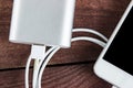 Top View of Charging Smartphone with grey powerbank Royalty Free Stock Photo