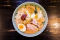 Top view of Chashu Pork in Ramen Pork Bone and Spicy Paste Soup Kara Miso Ramen with Chashu Pork, Scallion, Sprout, Corn,