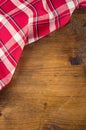 Top view of checkered kitchen towels on wooden table