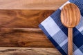 Top view of checkered kitchen towels on wooden table