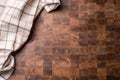 Top of view checkered tablecloth on empty wooden butcher board